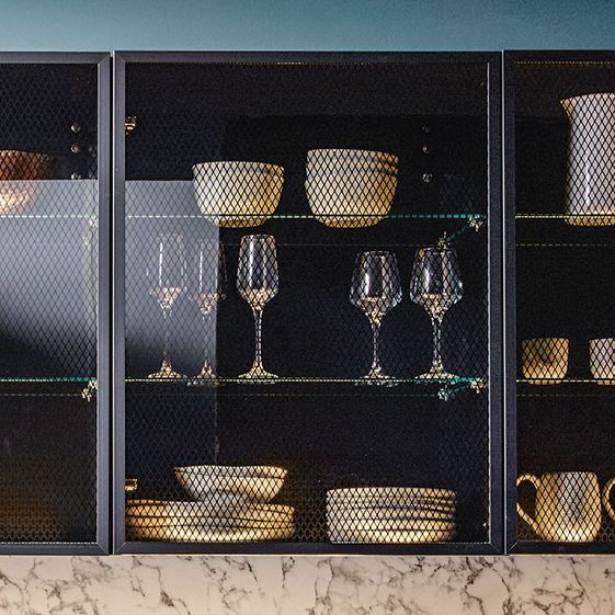 Tall shelf units with black transparent glasses as fronts