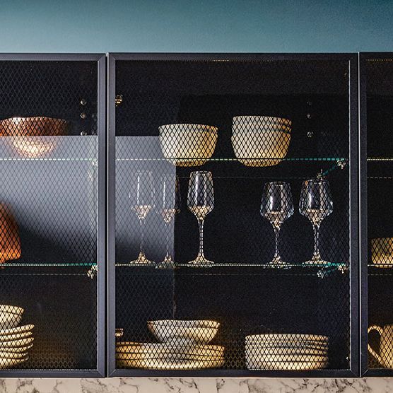 Tall shelf units with black transparent glasses as fronts