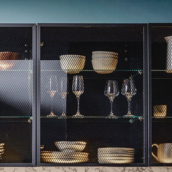 Tall shelf units with black transparent glasses as fronts