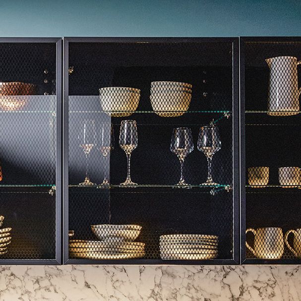 Tall shelf units with black transparent glasses as fronts